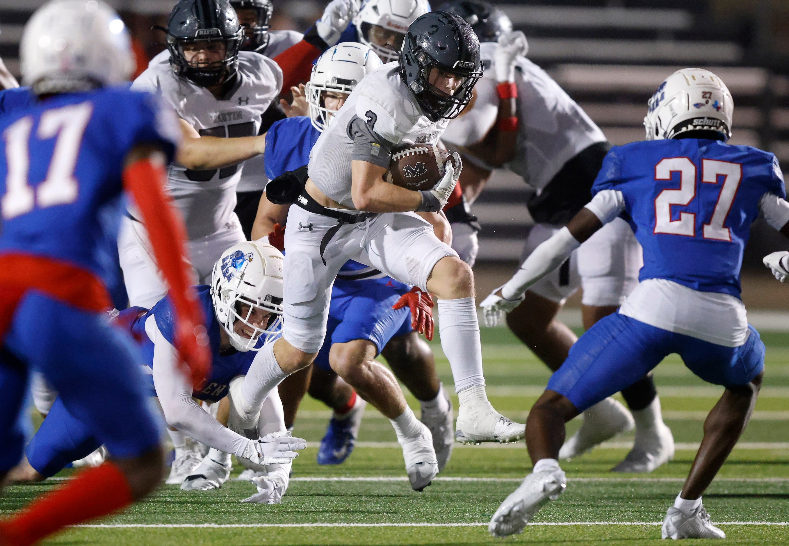 Arlington Martin wide receiver Brooks Brigance (3) breaks through the Allen line for a...