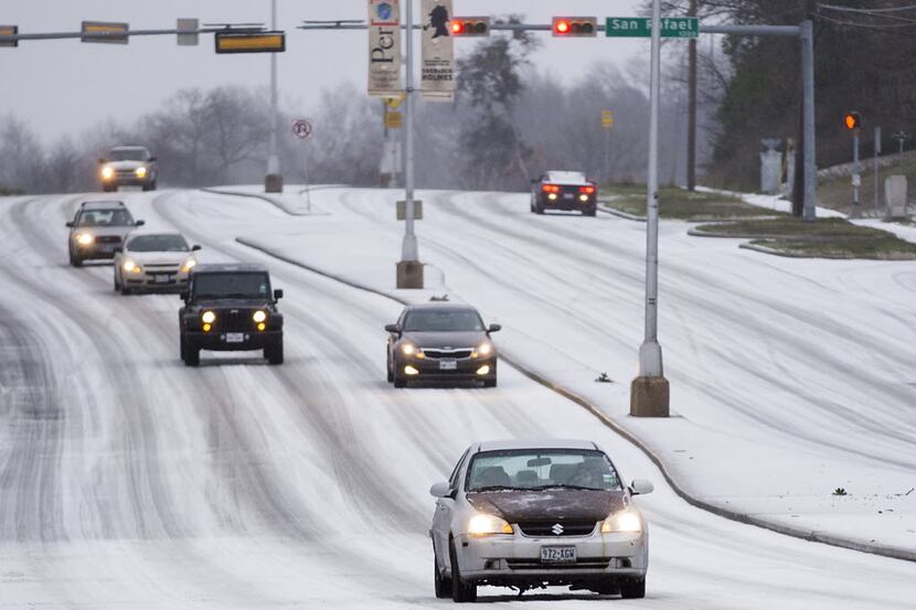 Here's a driving nightmare: Traffic moves slowly on Garland Road near White Rock Lake as icy...