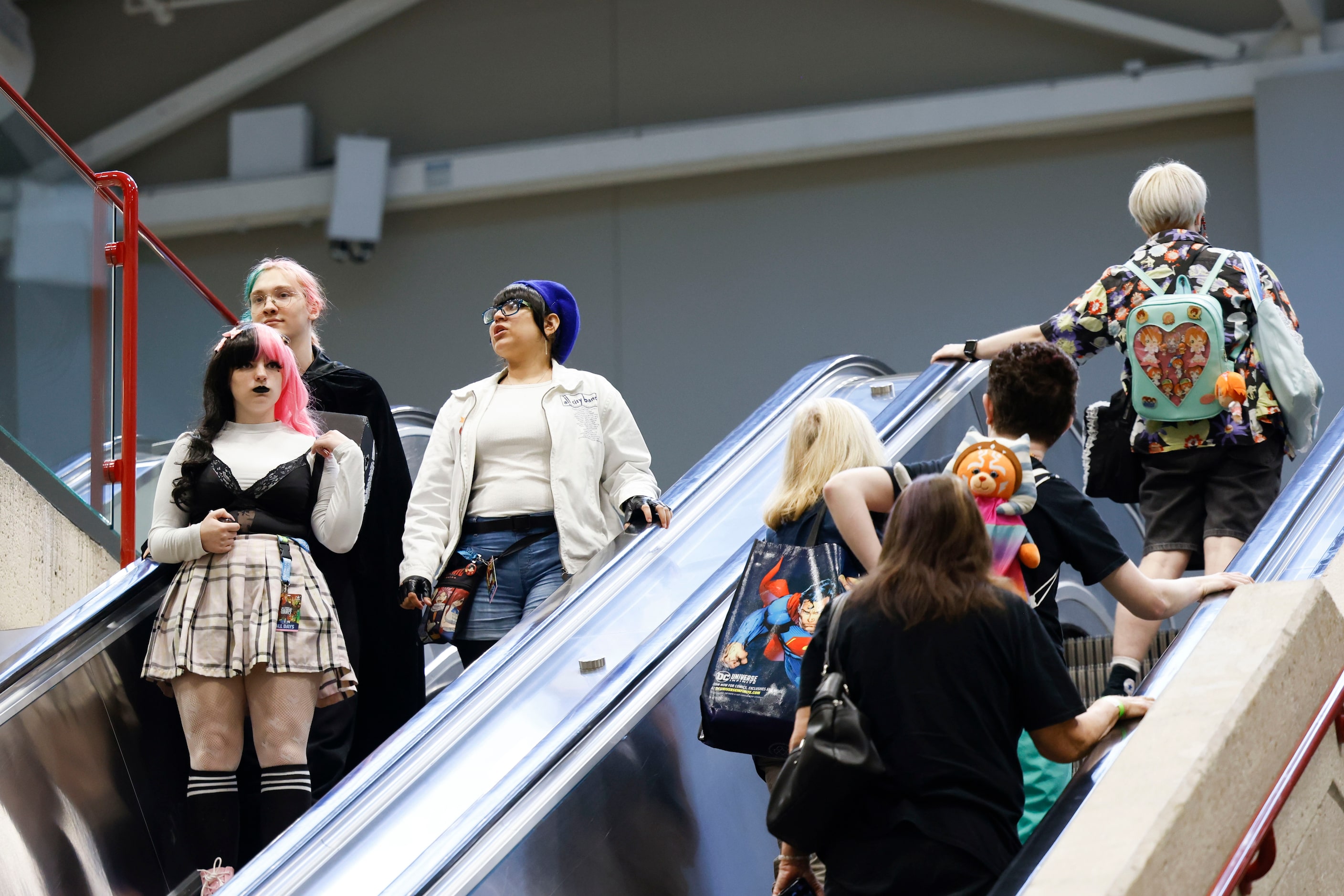 People wearing costumes walk around during Fan Expo Dallas on Friday, June 9, 2023, at Kay...