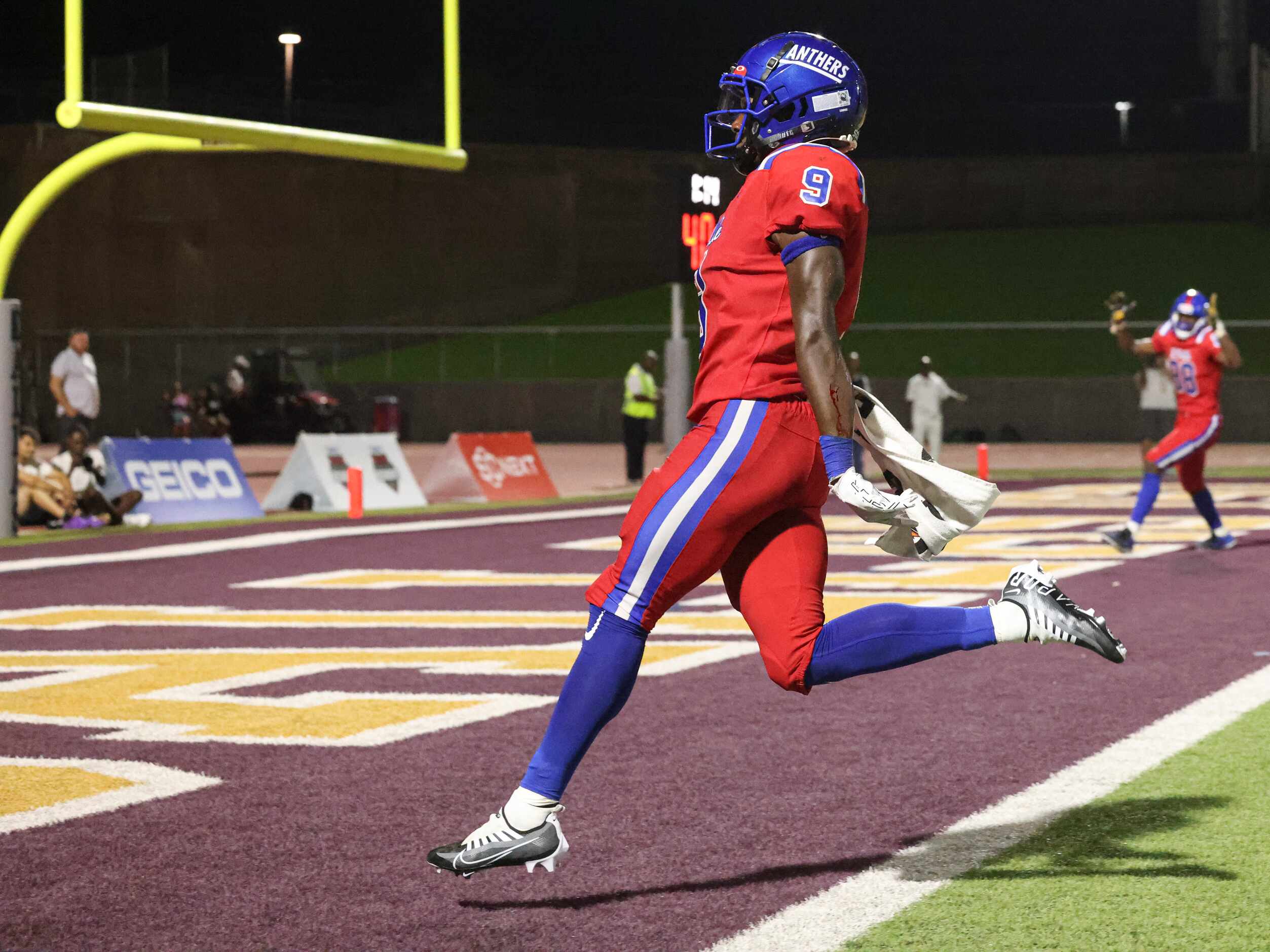 Duncanville High School Jerrale Powers (9) runs into the end zone, scoring a touchdown in...