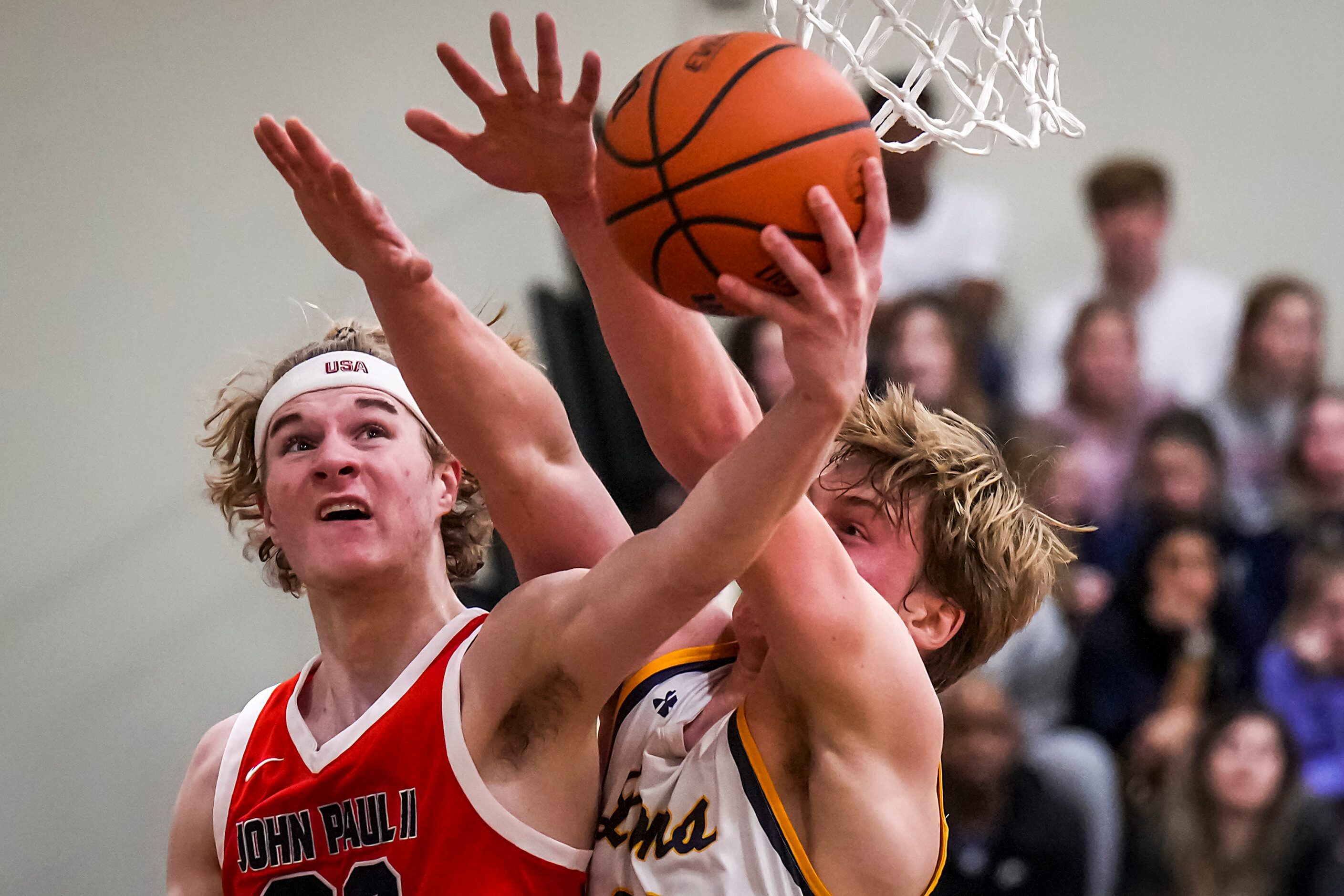 John Paul II's Liam McNeeley (30) drives to the basket as Prestonwood Christian's Matthew...