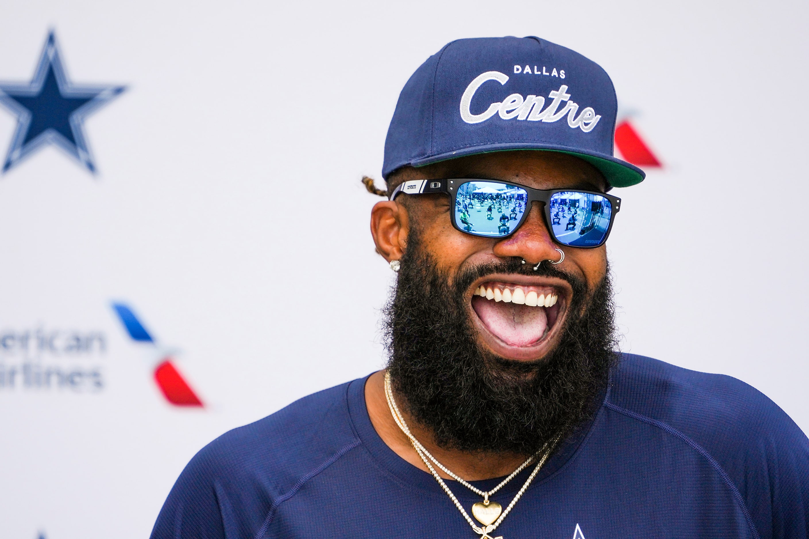 Dallas Cowboys running back Ezekiel Elliott laughs during a press conference following the...