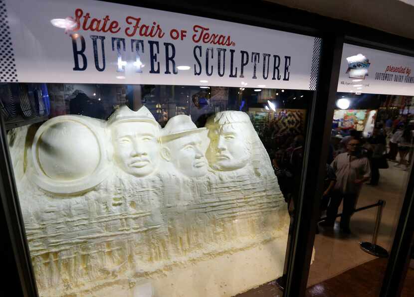 People look at a butter sculpture at the State Fair of Texas in Dallas on Sunday, October 1,...
