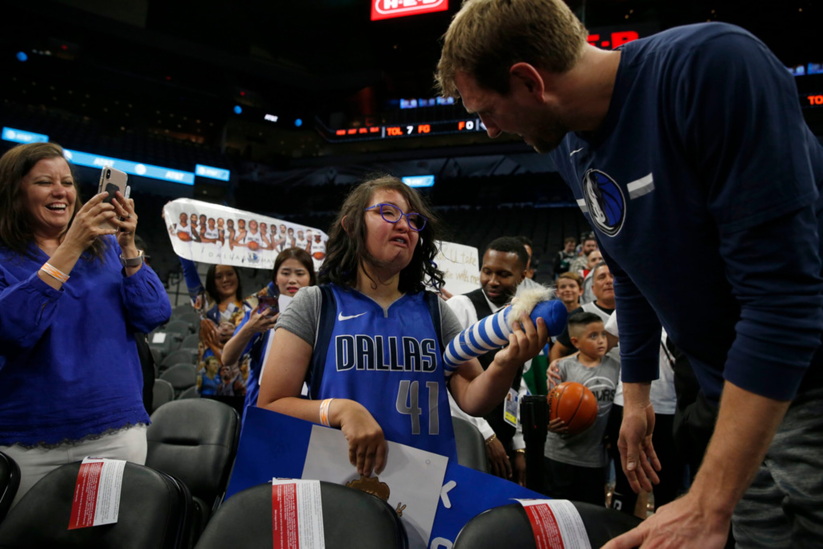 Missy Smedley (from left) photographs her daughter Anna Smedley, 16, as she talks with...