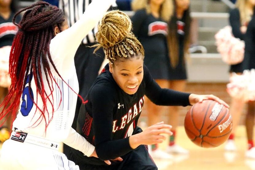Mansfield Legacy's Harmoni Turner (4) drives past Mansfield Summit's Lindsey Claude during a...