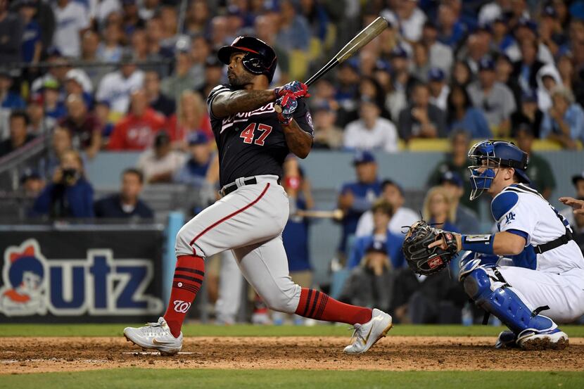 LOS ANGELES, CALIFORNIA - OCTOBER 09: Howie Kendrick #47 of the Washington Nationals hits a...