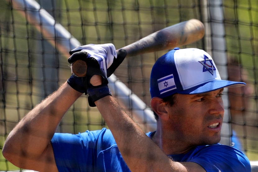 Israel Olympic baseball player Ian Kinsler takes batting practice at Salt River Fields...