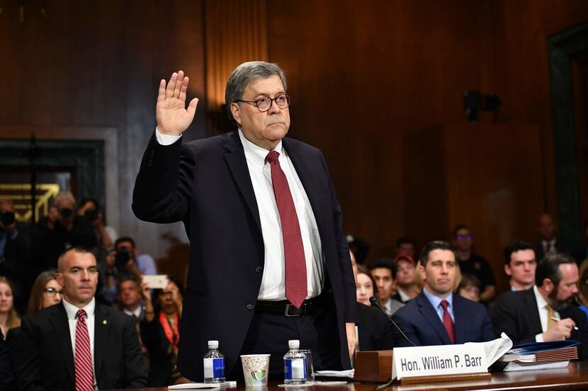 Attorney General William Barr is sworn in before testifying at the Senate Judiciary...