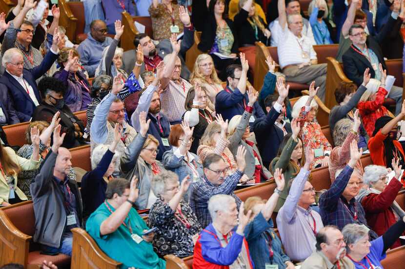 Delegates of the north Texas Conference vote in favor of 41 local churches leaving the...