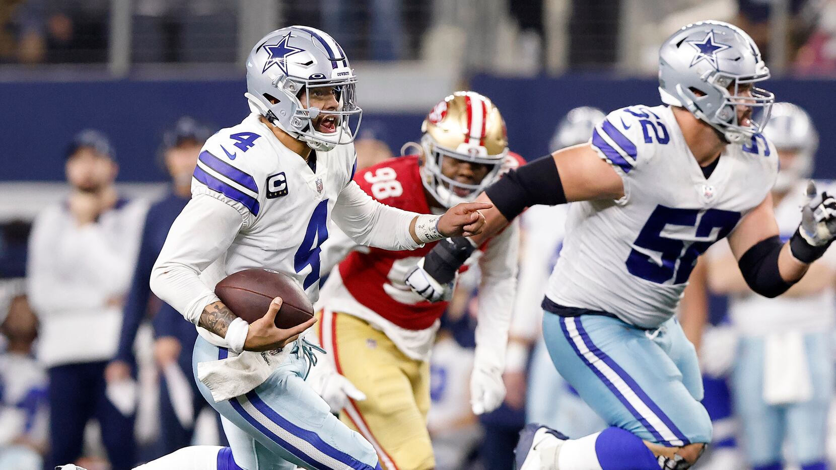 Dallas Cowboys quarterback Dak Prescott (4) takes off running on a draw play in the final...