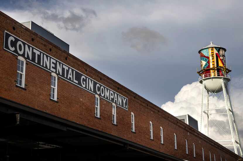 A new mural by street artist Shepard Fairey overlooks the Continental Gin Building in Deep...