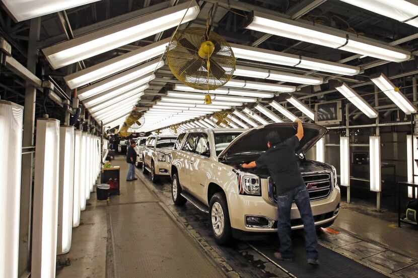  Autoworkers build SUVs at GM Arlington plant.