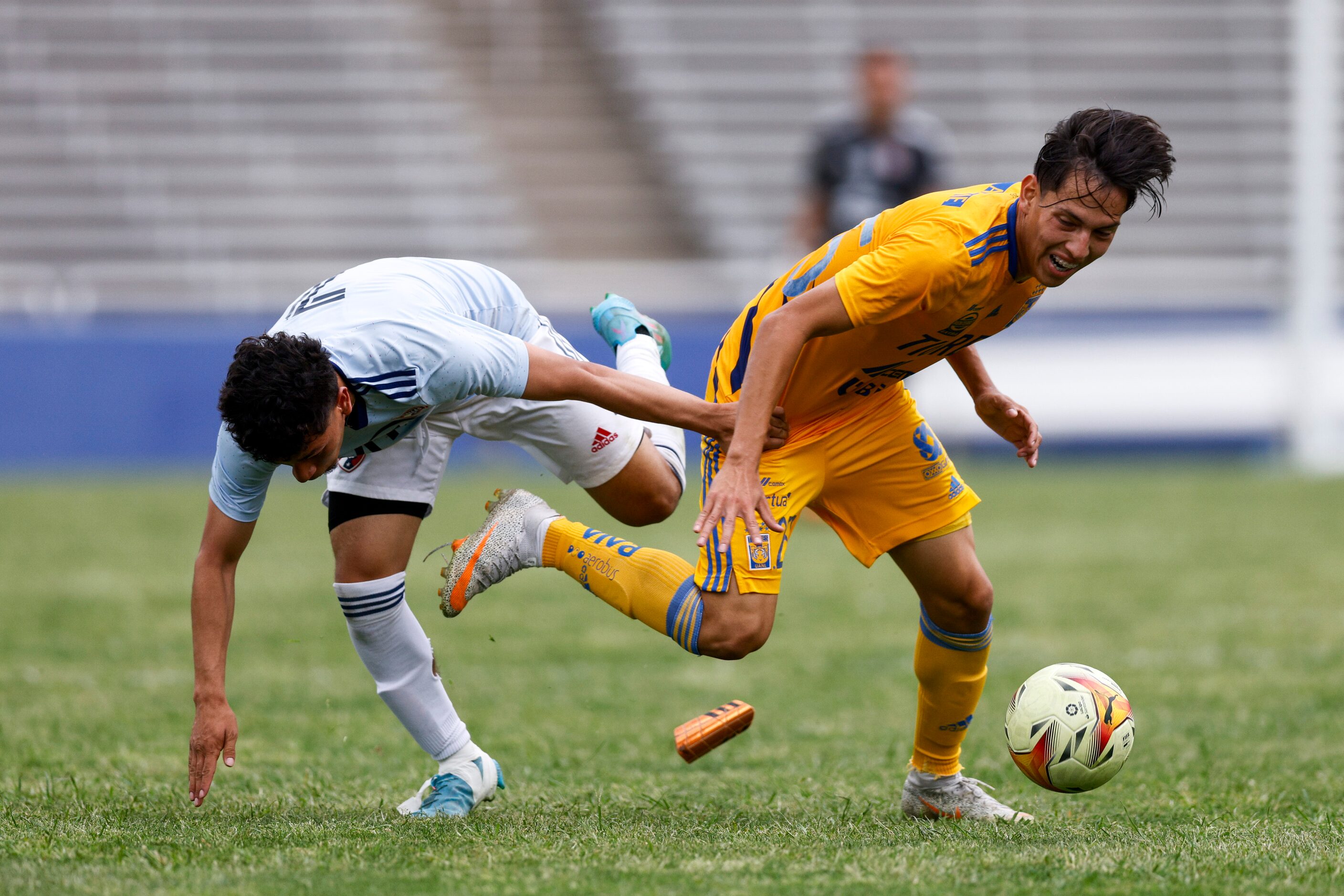 FC Dallas’ Jose Gutierrez (7) grabs Tigres UANL midfielder Rodrigo Abdiel Ramos Cabrera...