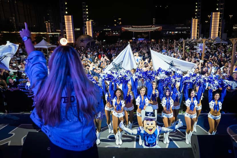 Dallas Cowboys fans, cheerleaders and mascot Rowdy awaited the team’s first round pick in...