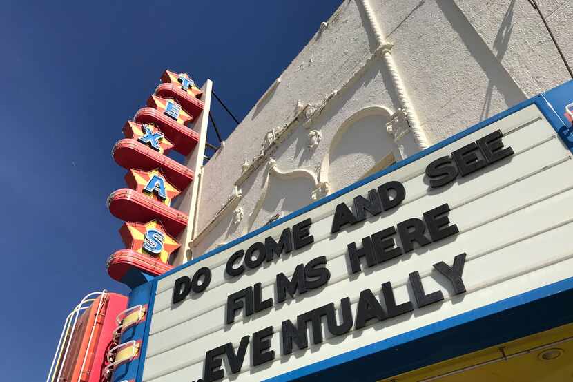 "Do come and see films here ... eventually," the Texas Theatre marquee said in May. The...