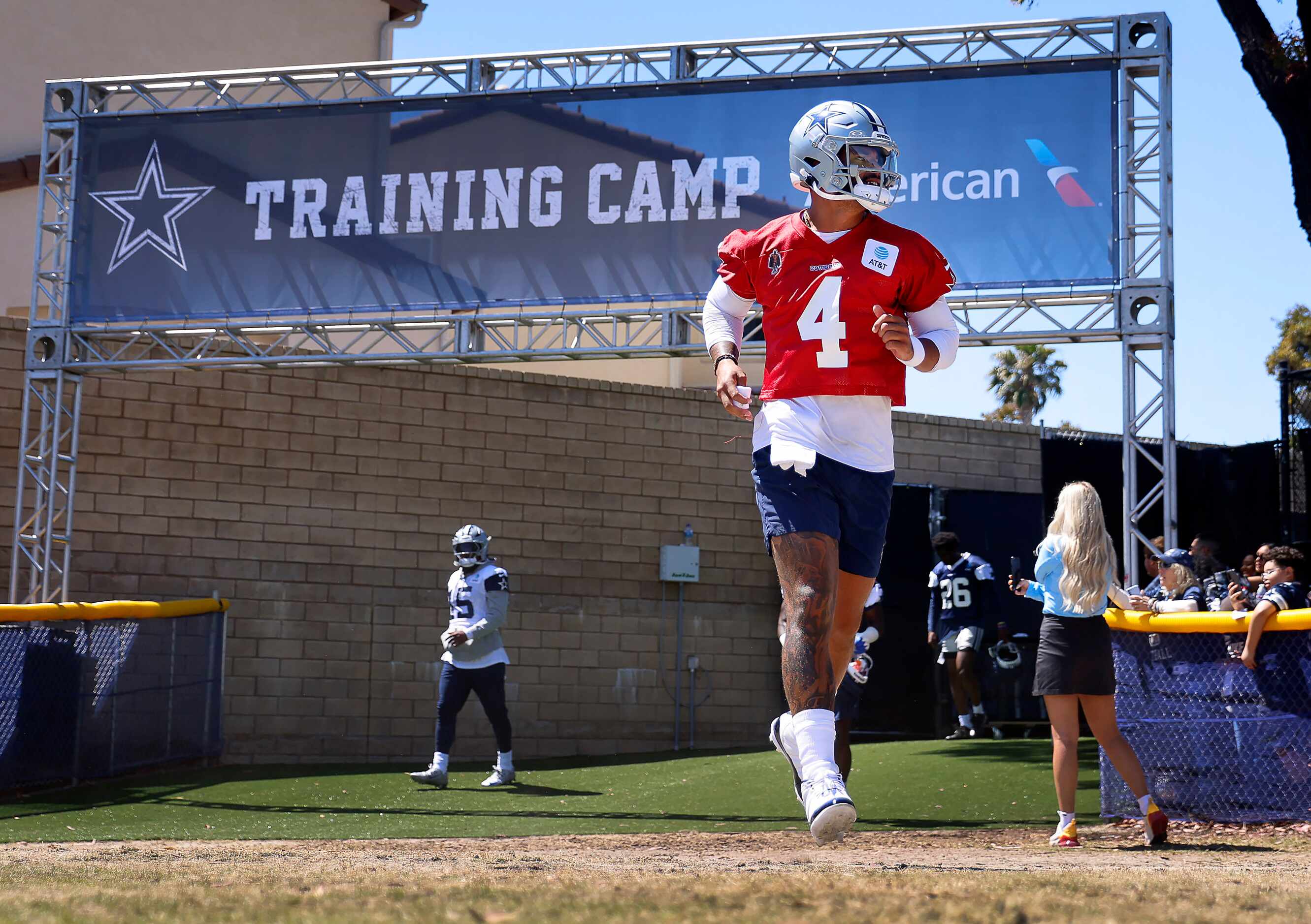Dallas Cowboys quarterback Dak Prescott (4) jogs onto the field for a training camp practice...