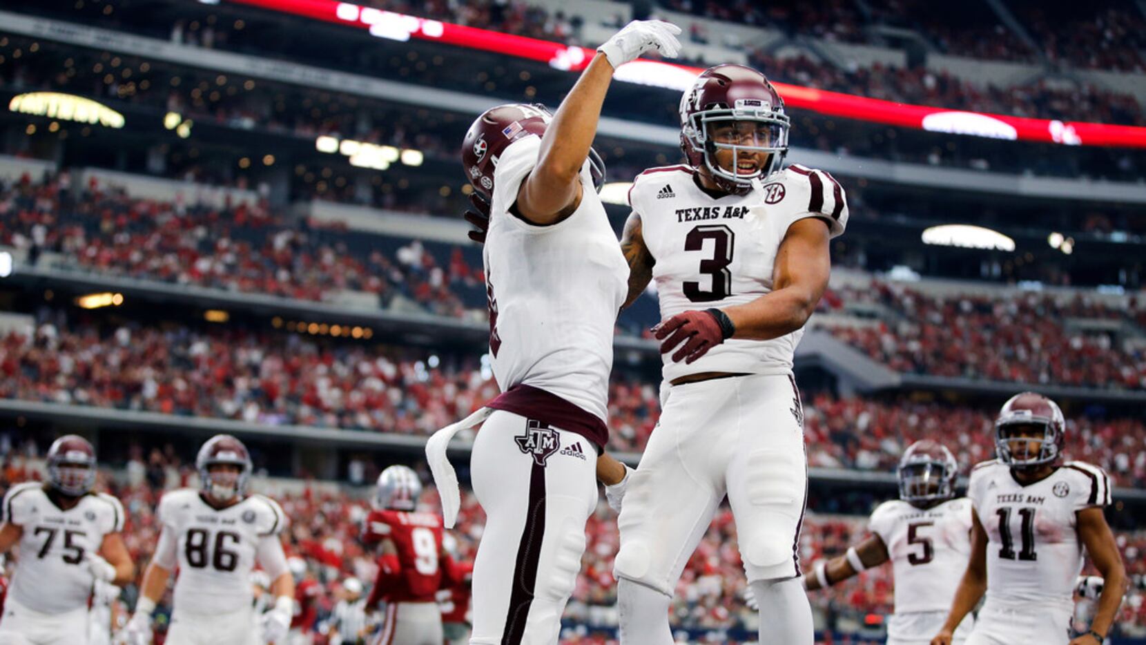 Texas A&M Aggies wide receiver Christian Kirk (3) is congratulated on his fourth quarter...