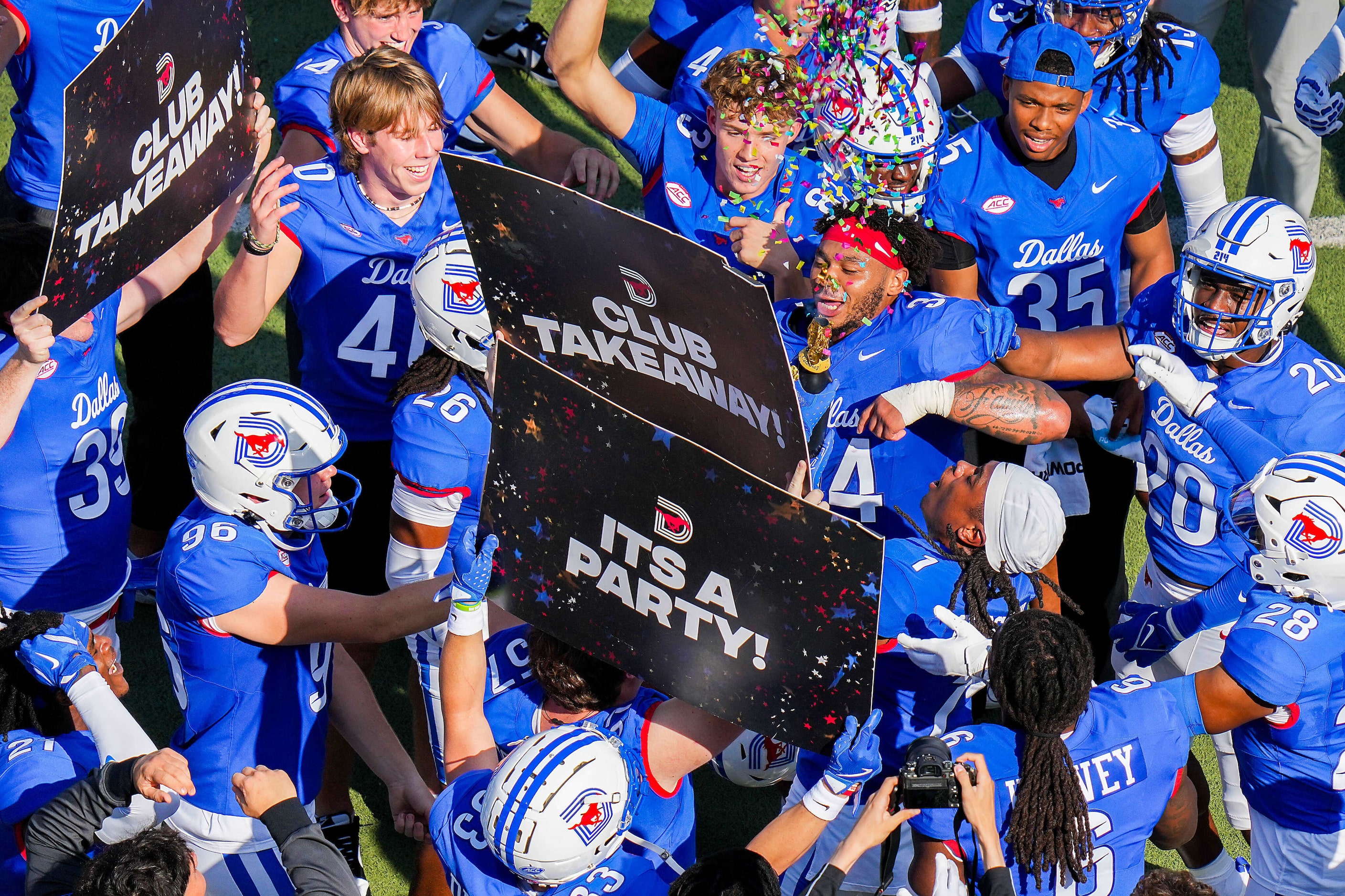 SMU safety Brandon Crossley (1) celebrates with teammates after returning a fumble 50 yards...