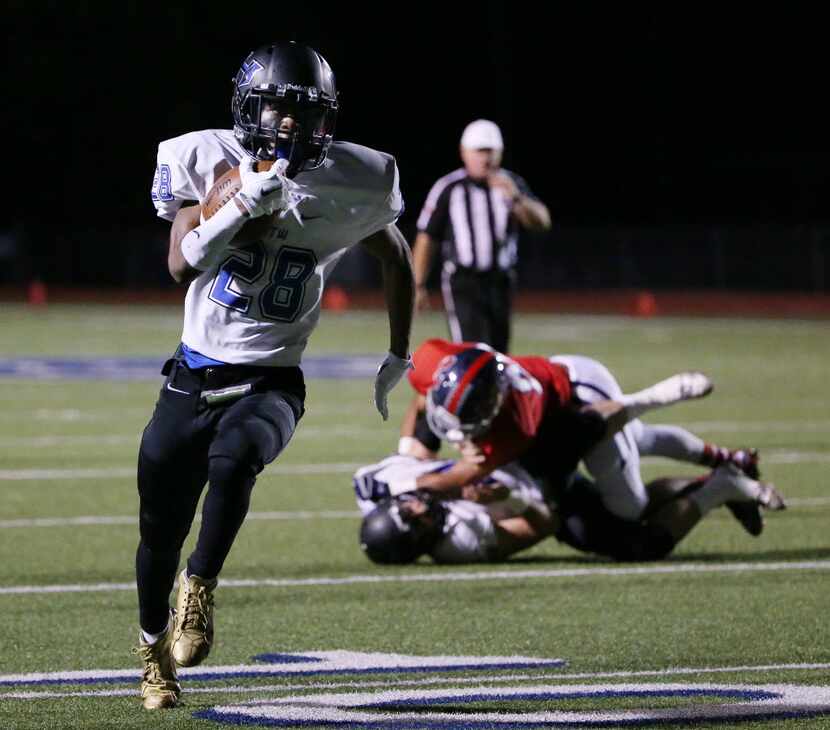 Hebron running back Derian Vaughn (28) scores a rushing touchdown on a fourth down and...