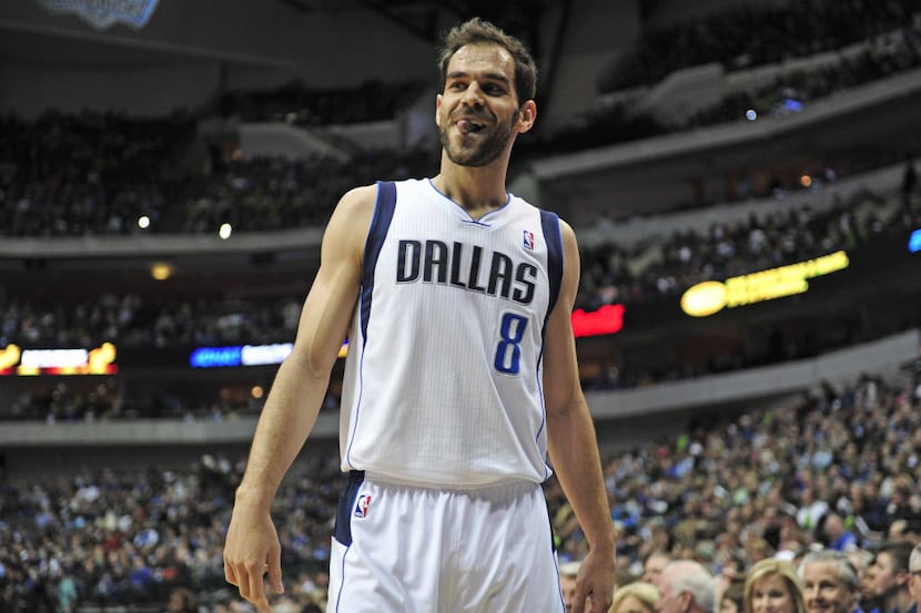 Dallas Mavericks point guard Jose Calderon reacts after a foul was called against him during...