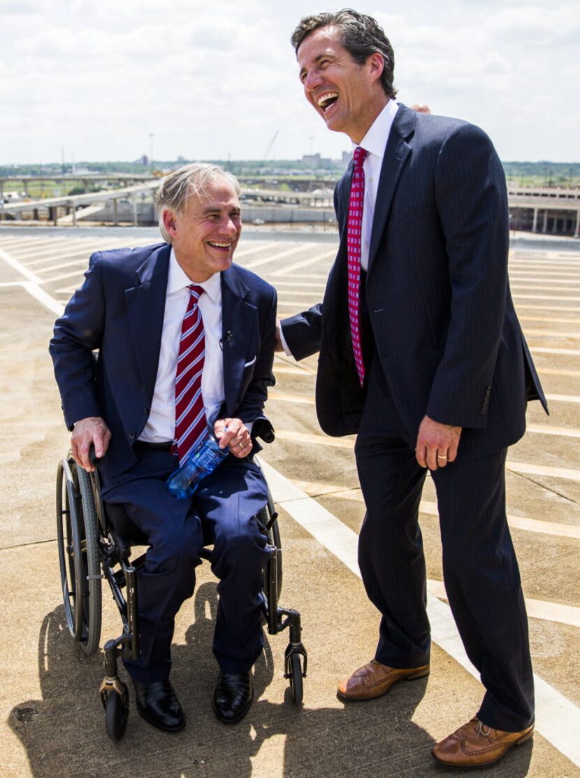 Sen. Kelly Hancock, R-North Richland Hills, right, shared a laugh with Gov. Greg Abbott...