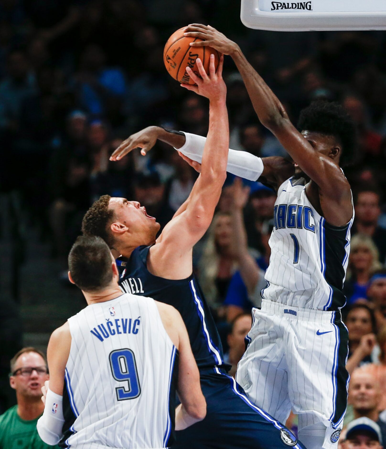 Orlando Magic forward Jonathan Isaac (1) blocks a shot by Dallas Mavericks forward Dwight...