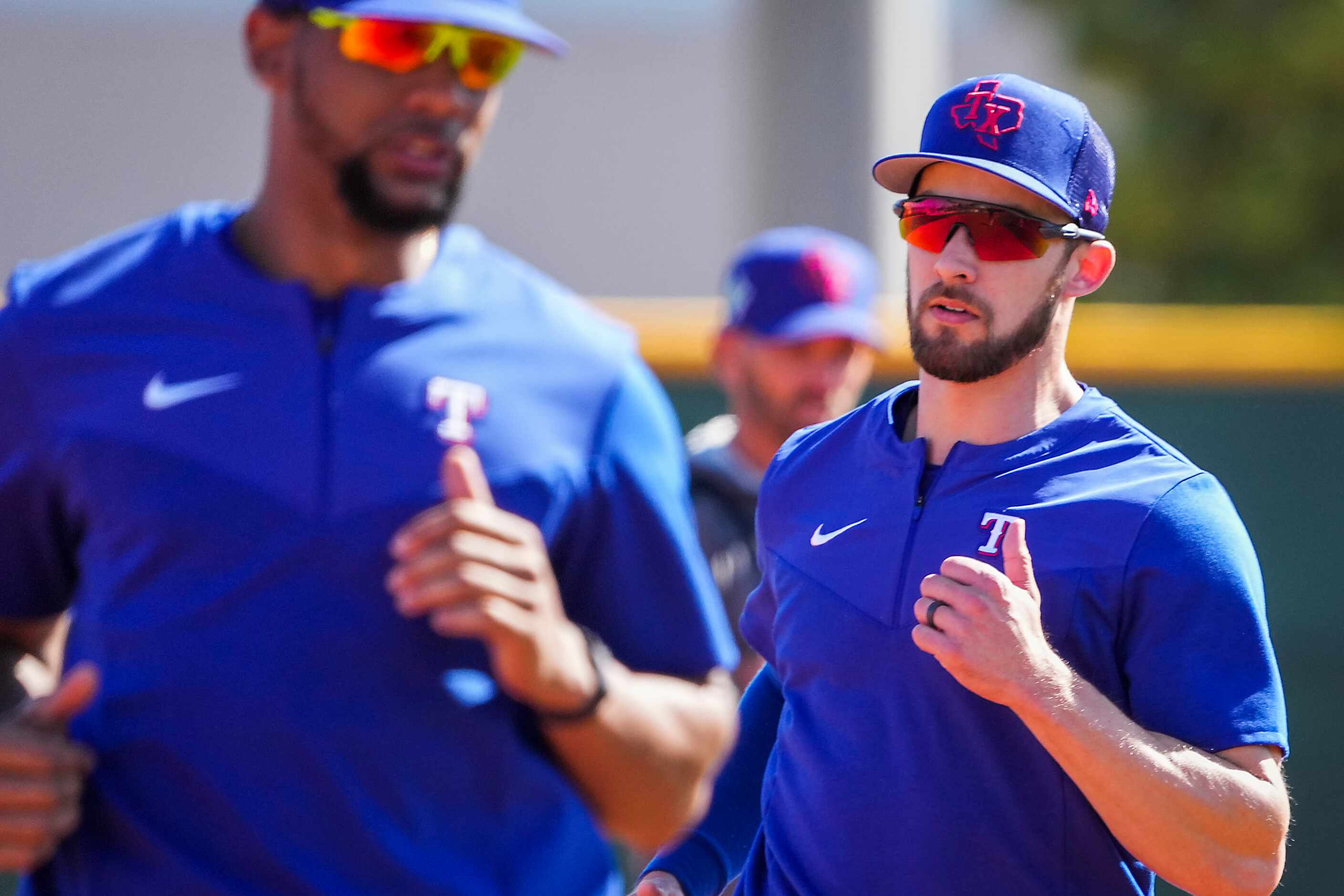 Texas Rangers outfielders Eli White (right) and Leody Taveras participate in a base running...