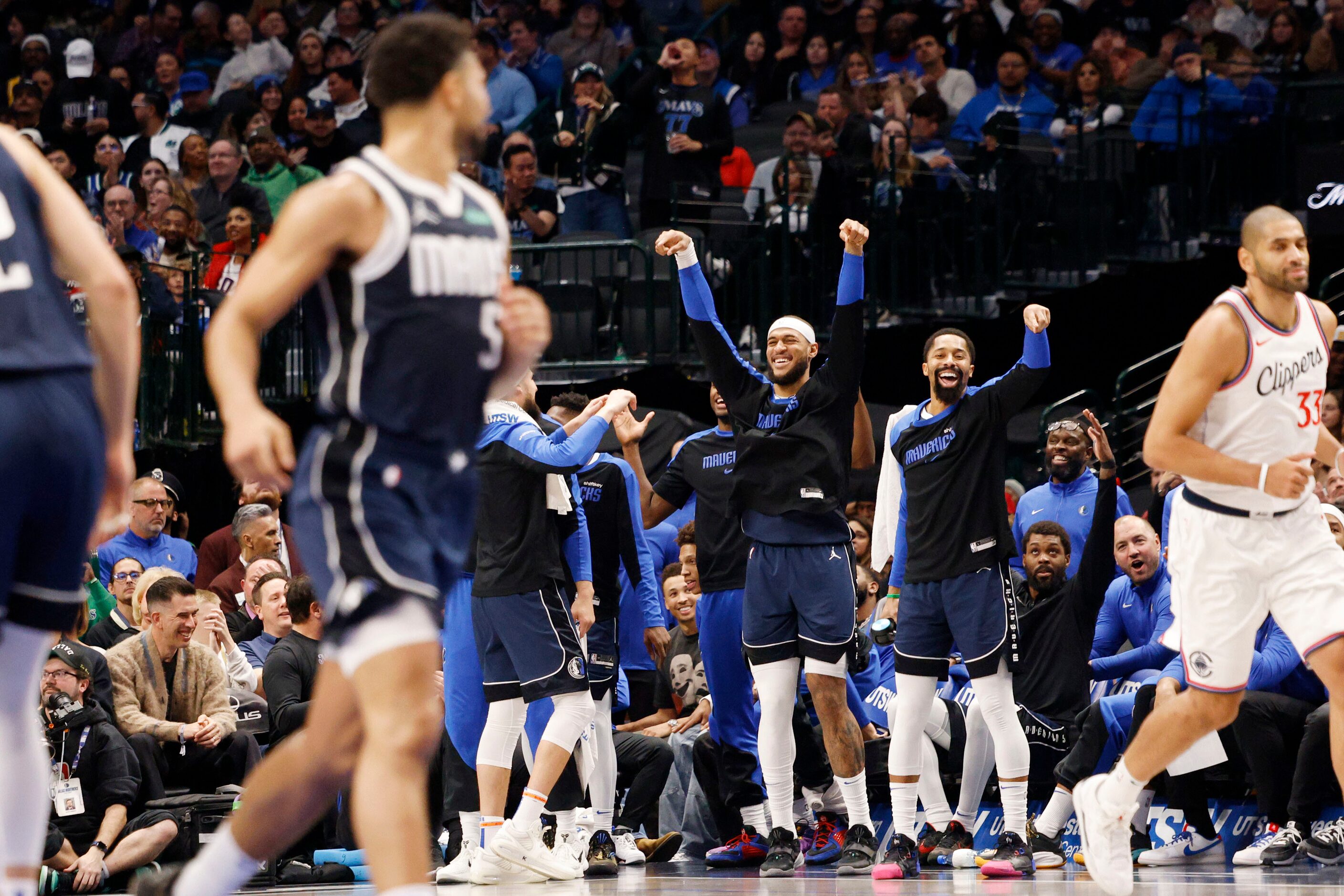 Dallas Mavericks players celebrate after Dallas Mavericks guard Quentin Grimes (5) scores...