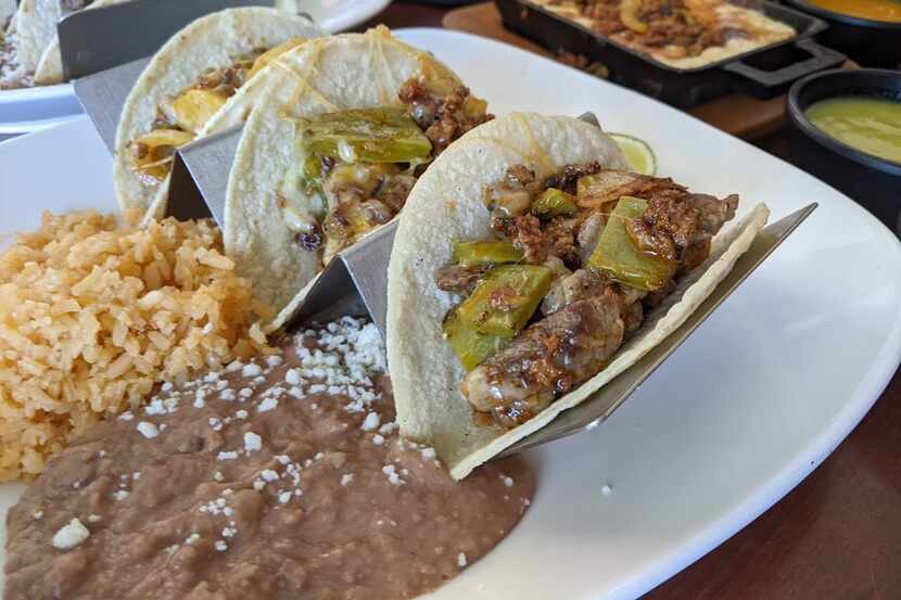 Tacos molcajetes are a namesake specialty at Los Molcajetes. The excellent taco trio...