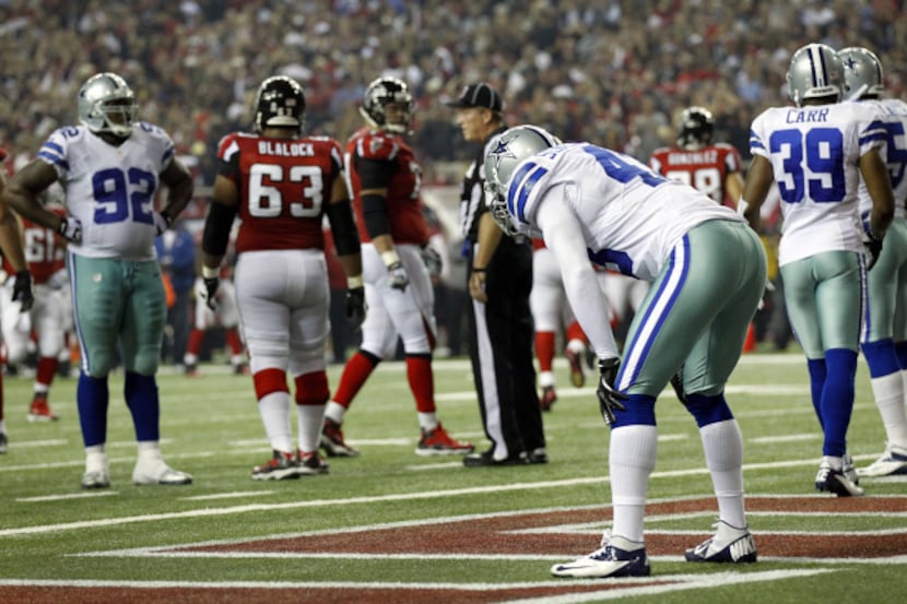 Dallas Cowboys free safety Gerald Sensabaugh (43) hangs his head after allowing Atlanta...