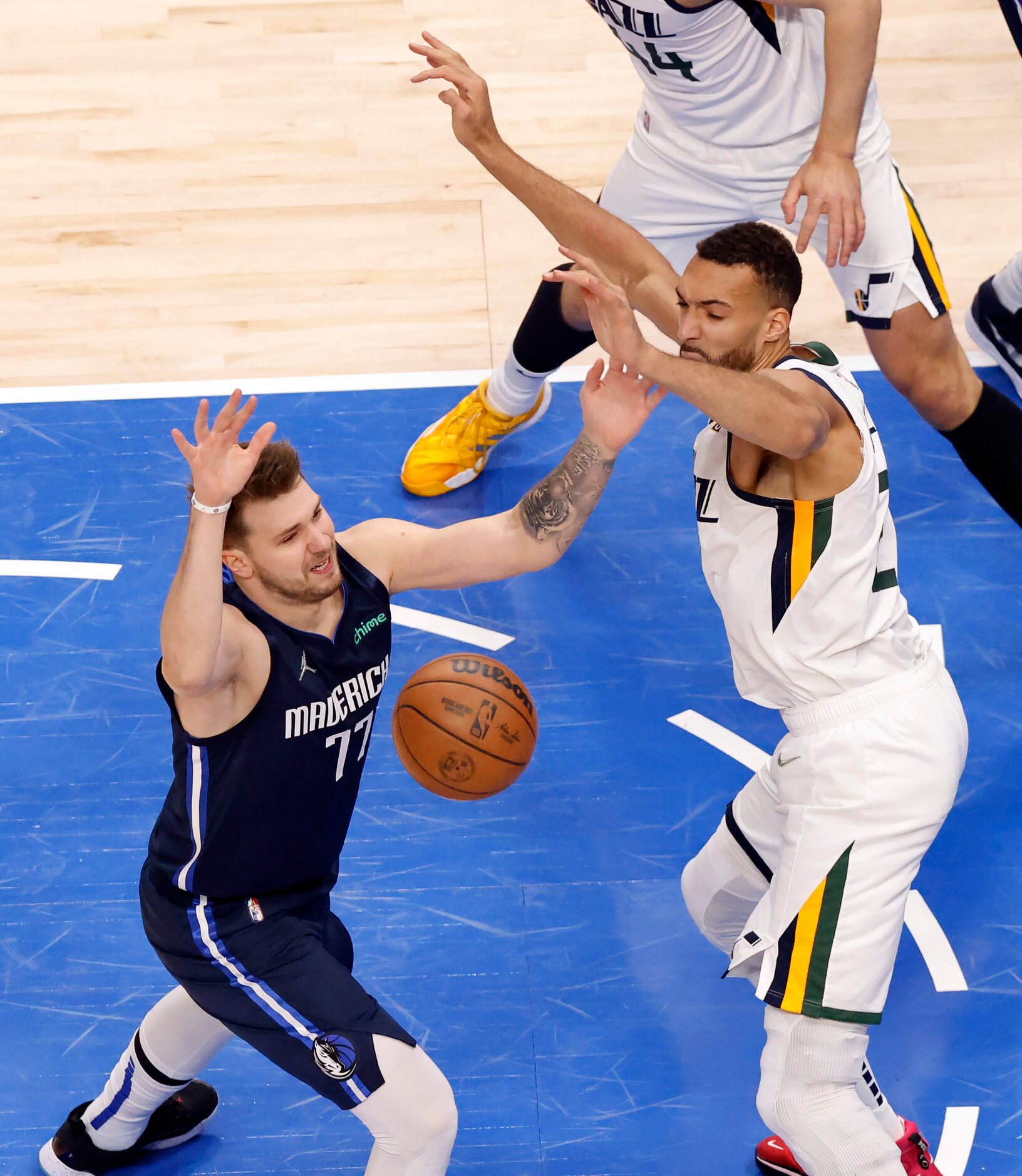 Dallas Mavericks guard Luka Doncic (77) has the ball knocked away by Utah Jazz center Rudy...