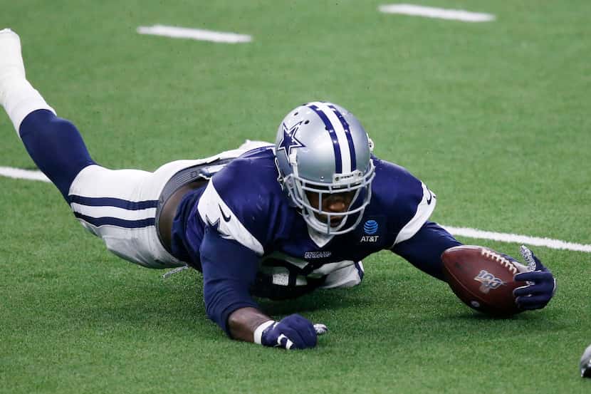 Cowboys defensive end Aldon Smith (58) dives for a fumble in practice during training camp...