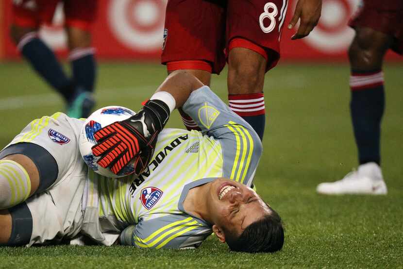 FC Dallas goalkeeper Jesse Gonzalez goes down after grabbing the ball on a corner kick in...