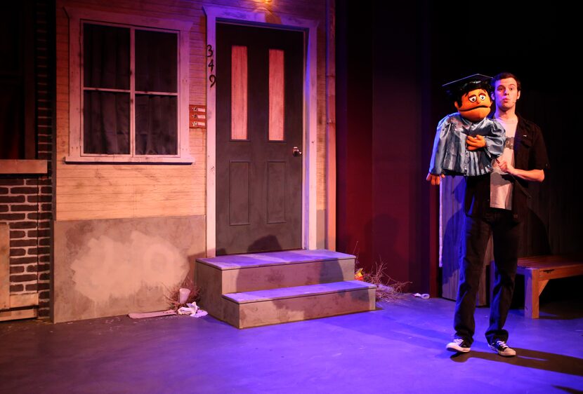 Matt Purvis performs as Princeton during the opening number of Avenue Q on January 11, 2014...