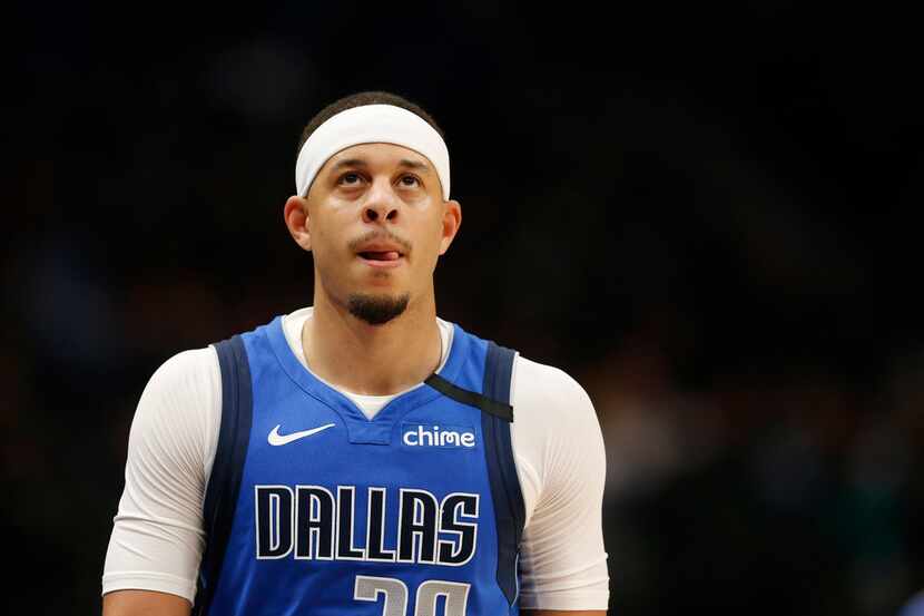 Dallas Mavericks guard Seth Curry (30) makes his way to the bench in a game against the New...