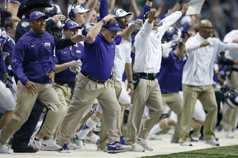 Jan 2, 2016; San Antonio, TX, USA; Texas Christian Frogs head coach Gary Patterson (center...