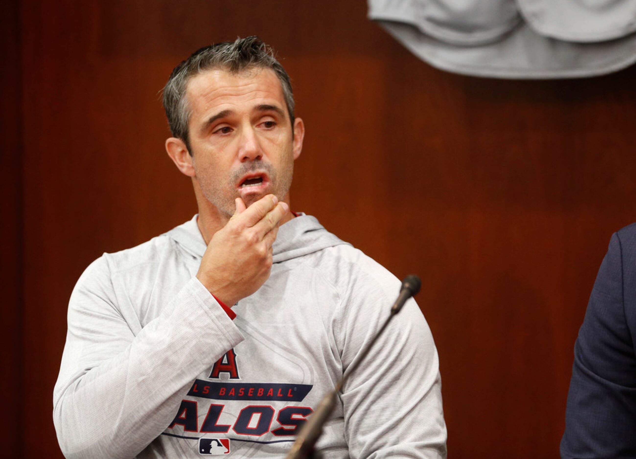 Los Angeles Angels manager Brad Ausmus reacts as he answers questions during a press...