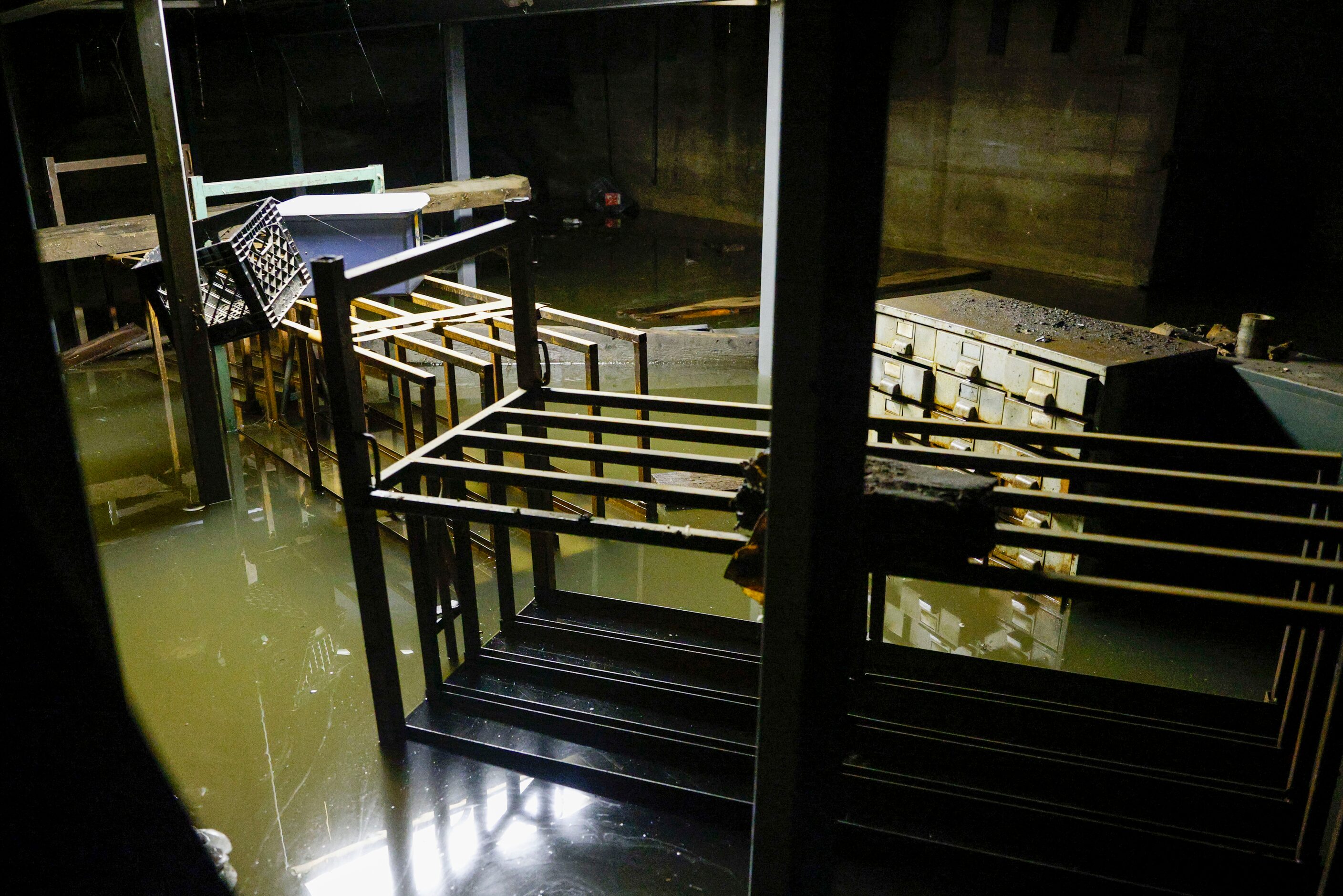 Water continues to flood the basement of McMurray Metals a day after storms dumped heavy...