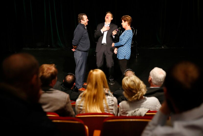 Improv comedian Frank Ford (center) of Four Day Weekend laughs as AngMar Companies employees...