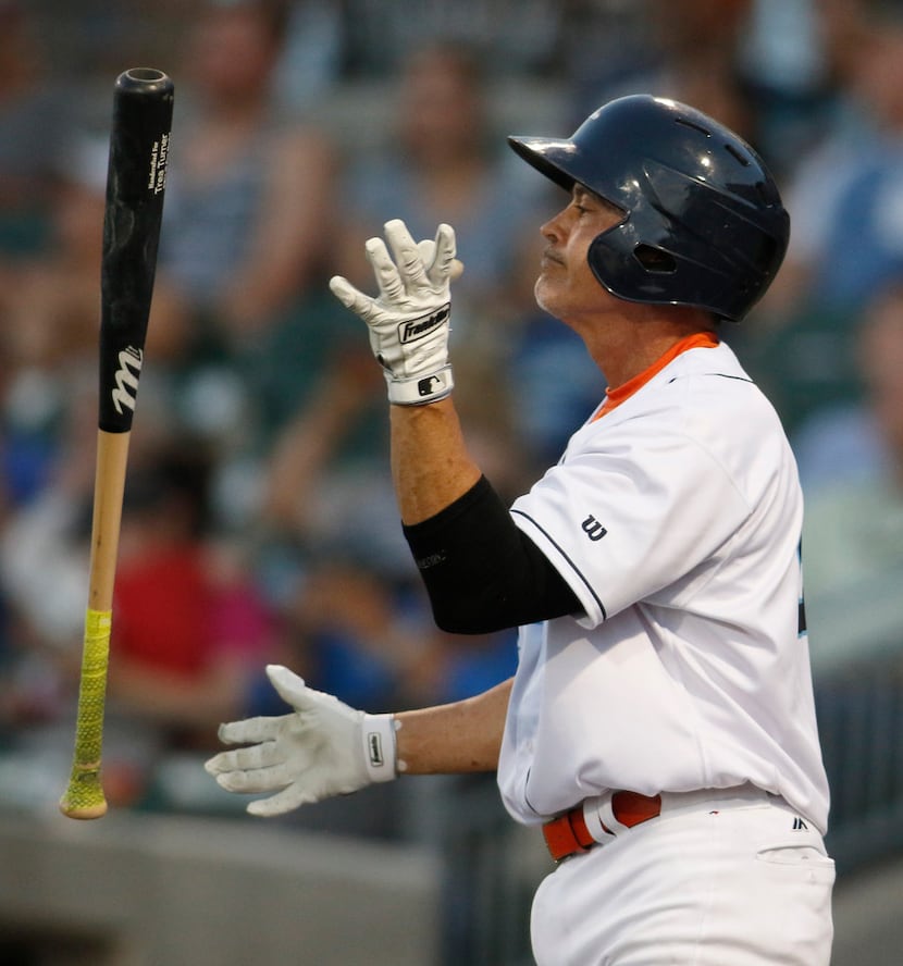 Cleburne Railroaders designated hitter Rafael Palmeiro tosses this bat after popping up a...