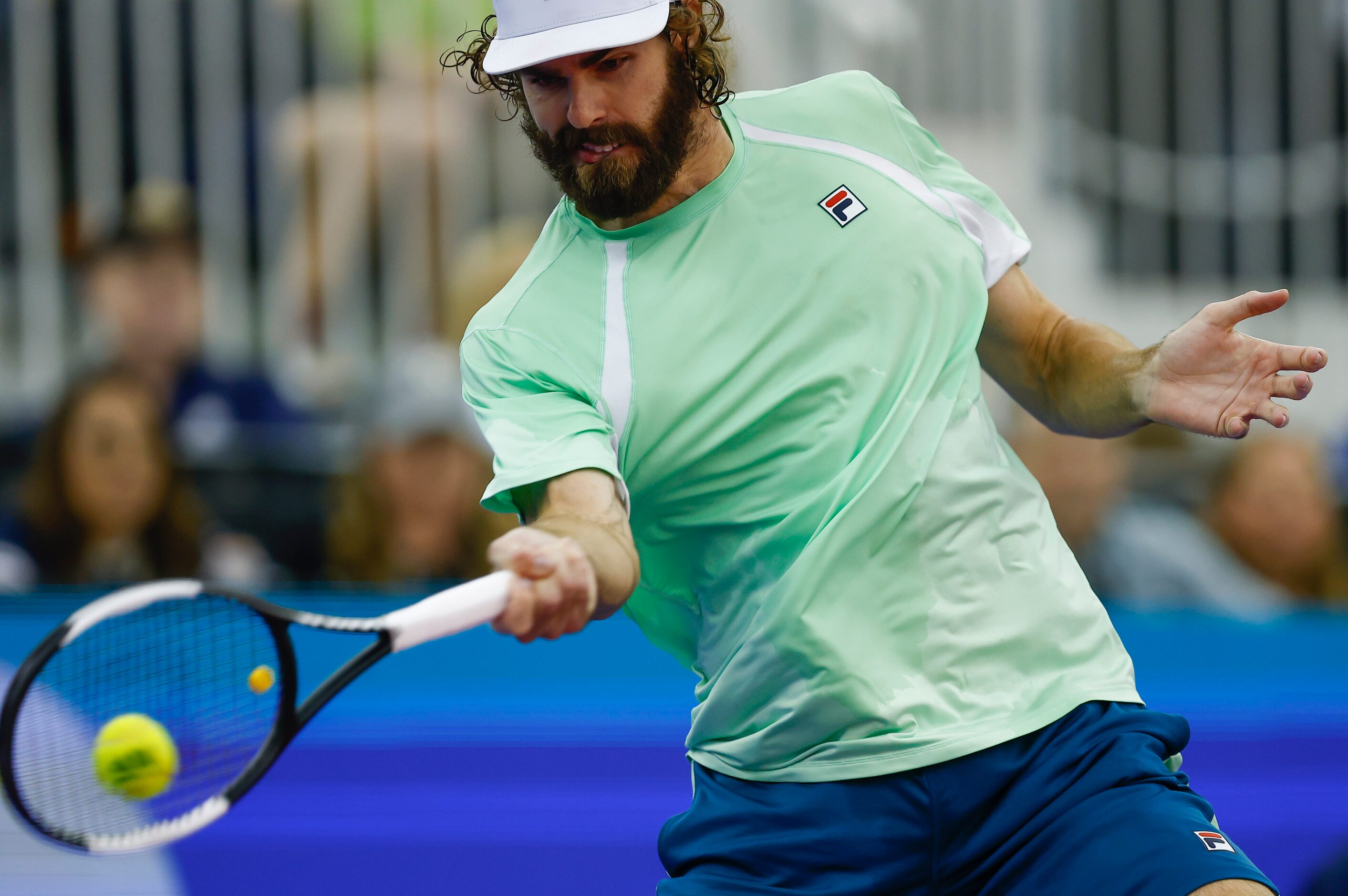 Reilly Opelka returns the ball during the finals ATP Dallas Open against Jenson Brooksby at...