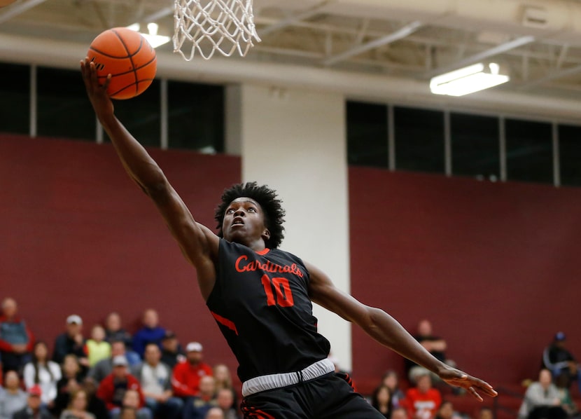 Irving MacArthur's Andrew Jones went for a layup against Highland Park in a Class 6A playoff...