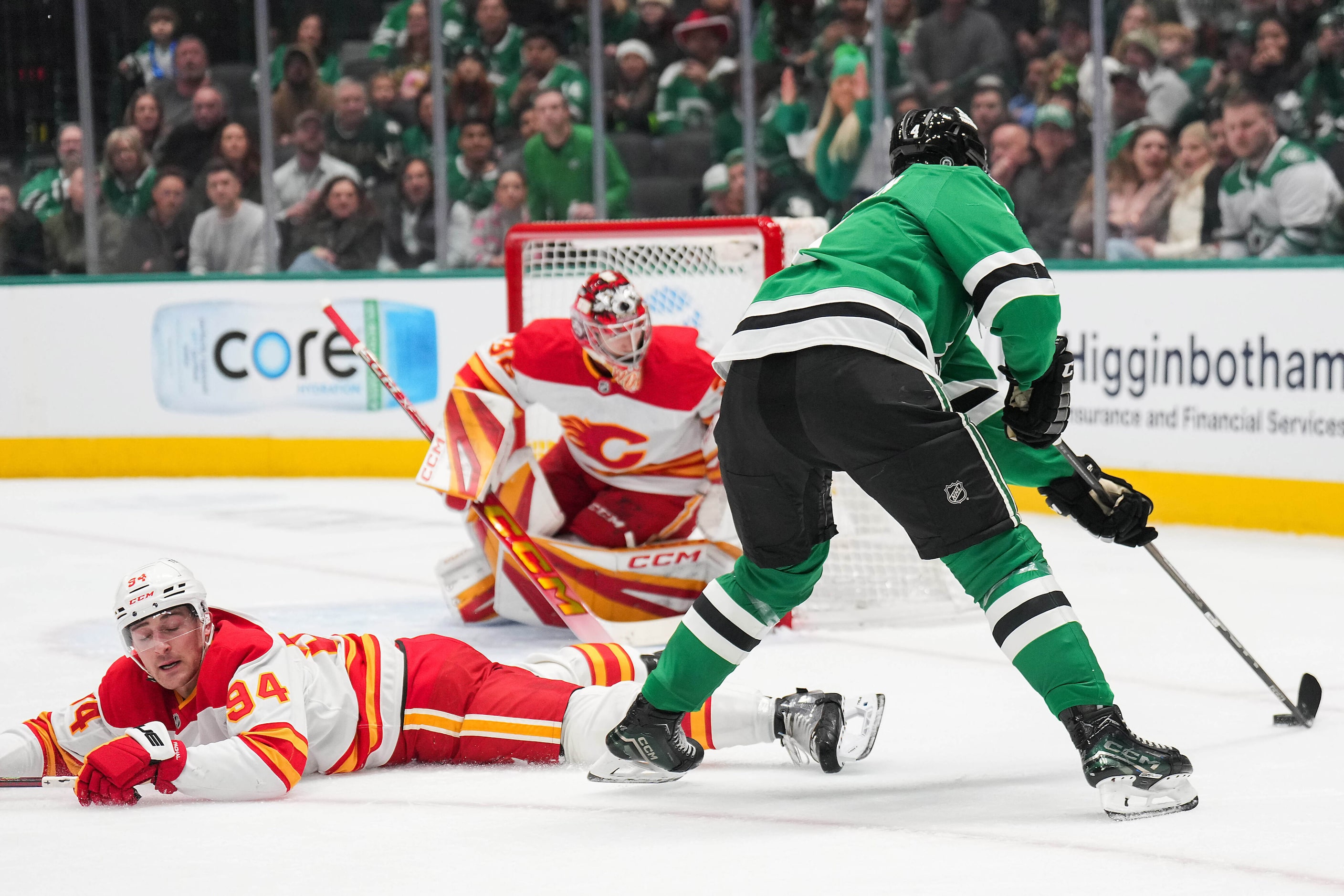 Dallas Stars defenseman Miro Heiskanen (4) controls the puck as Calgary Flames defenseman...