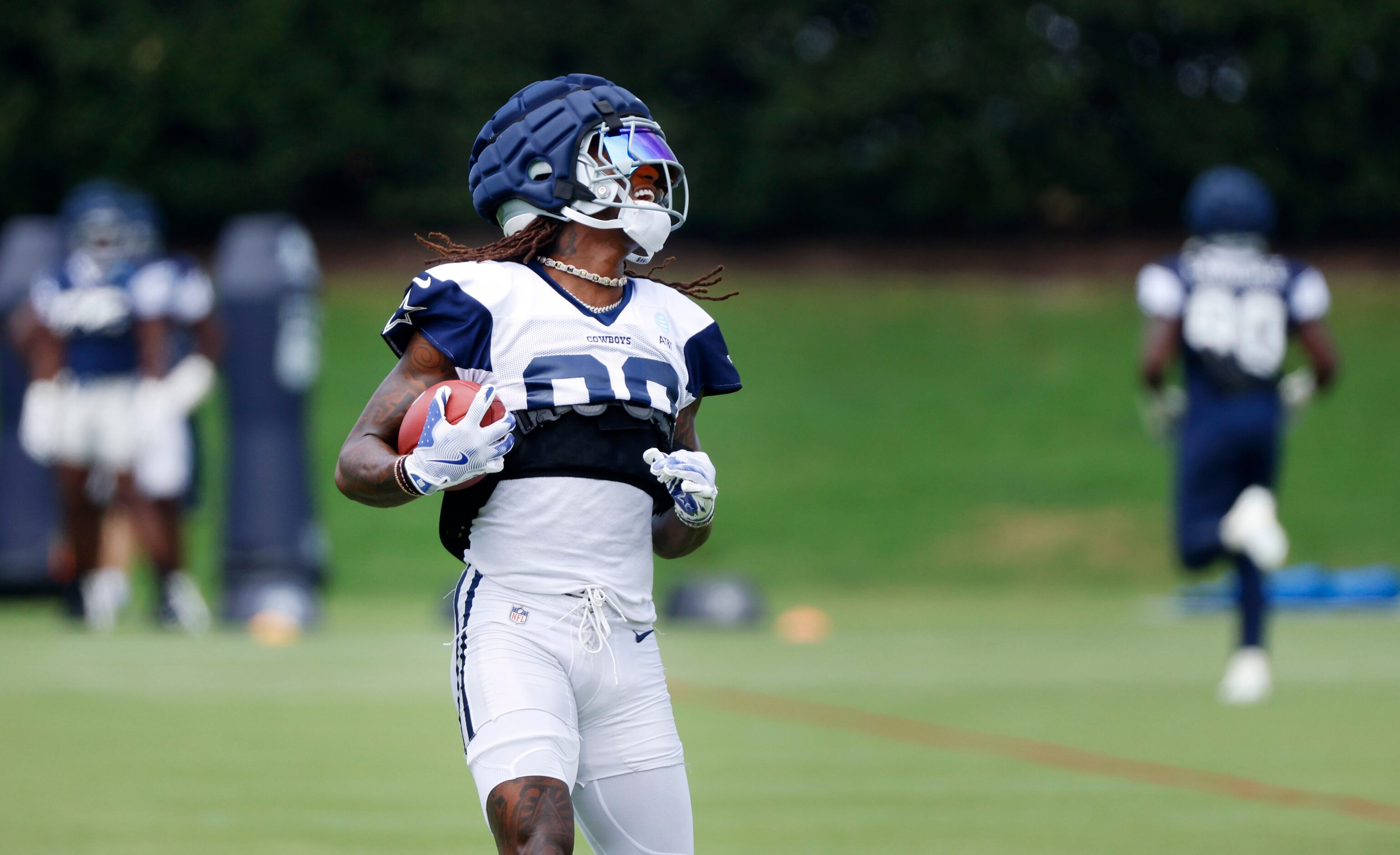 Dallas Cowboys wide receiver CeeDee Lamb (88) carries the ball after catching a pass during...