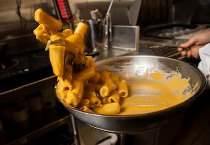 Giuliano Matarese combines the fresh pasta and sauce to make the Rigatoni Miss Pasta on...