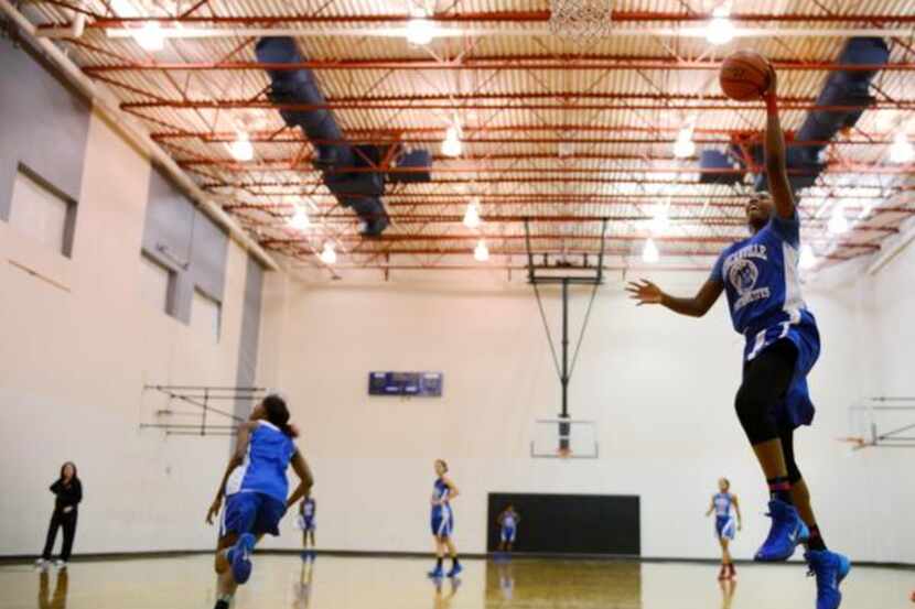 
Duncanville girls basketball player Ariel Atkins takes a shot during practice in...