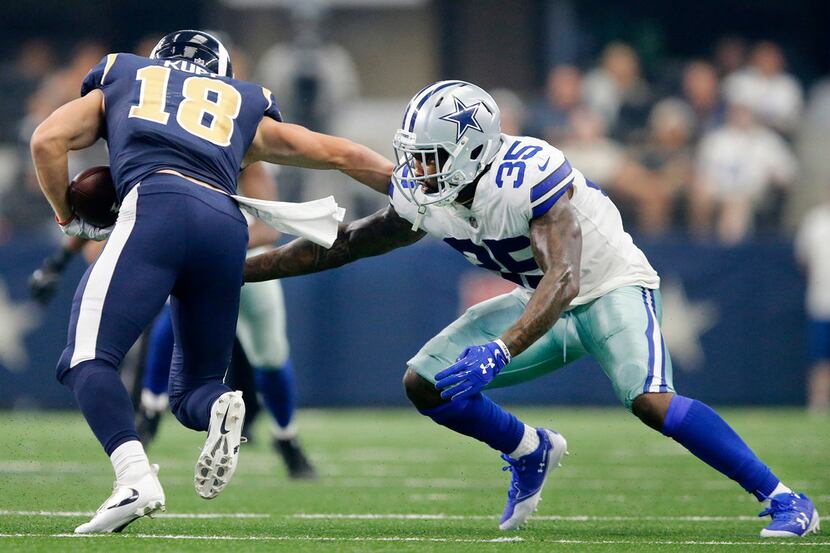 Dallas Cowboys strong safety Kavon Frazier (35) reaches for Los Angeles Rams wide receiver...