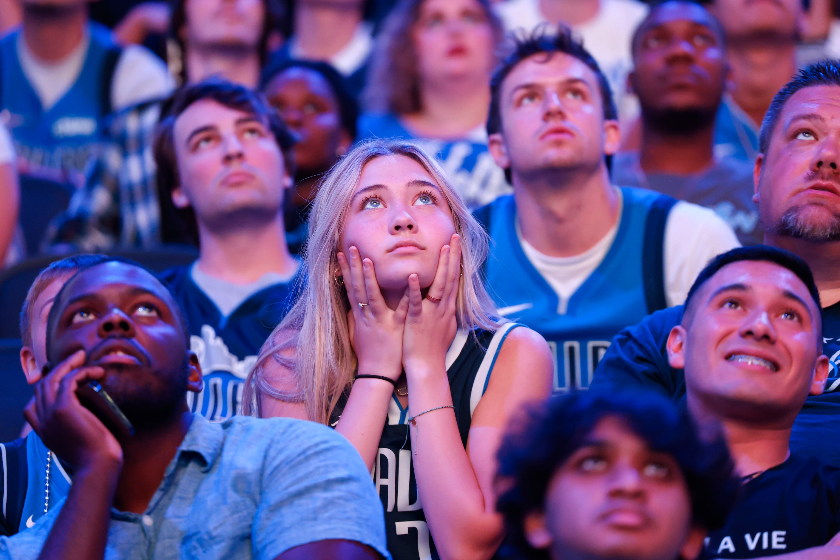 Dallas Mavericks fans look dejected following a three-pointer by Boston Celtics during a...