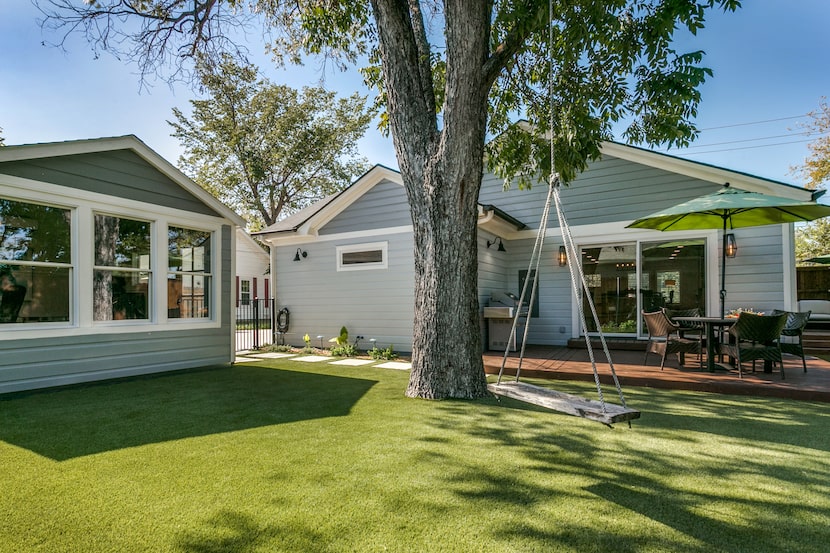 The home's low-maintenance backyard has turf and plenty of areas to entertain.