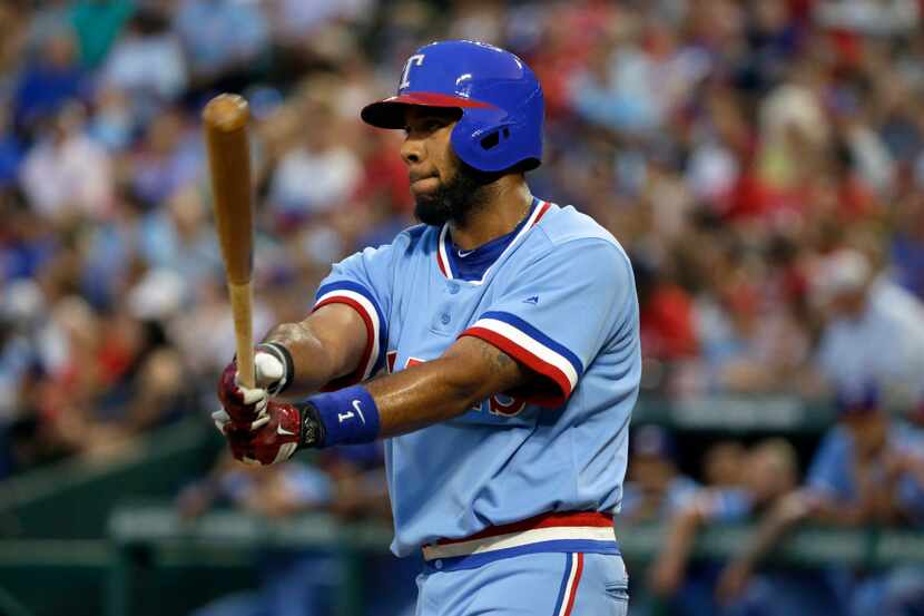 Texas Rangers' Elvis Andrus takes a practice swing before his at bat in the first inning of...